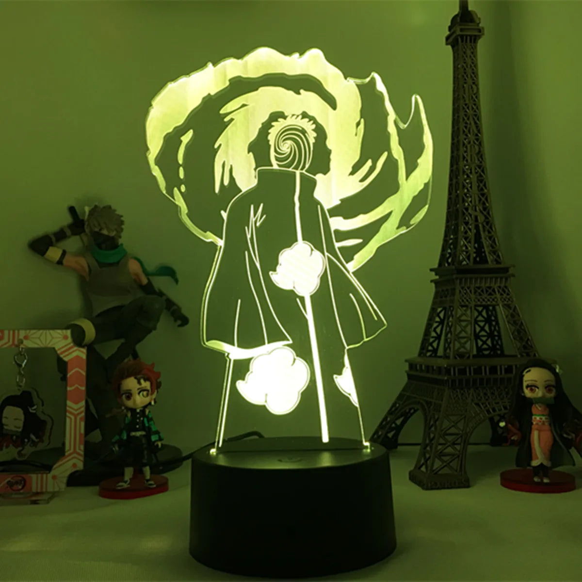 <img src="obito-madara-mode.jpg" alt="Obito Uchiha LED nightlight lamp in Madara mode, featuring Obito in Akatsuki cloak with swirling Mangekyou Sharingan effect. Perfect for anime fans of Naruto Shippuden, this unique lamp adds a mystical touch to any room. Ideal gift for fans of Madara Uchiha, Naruto decor, and Japanese anime collectibles.">