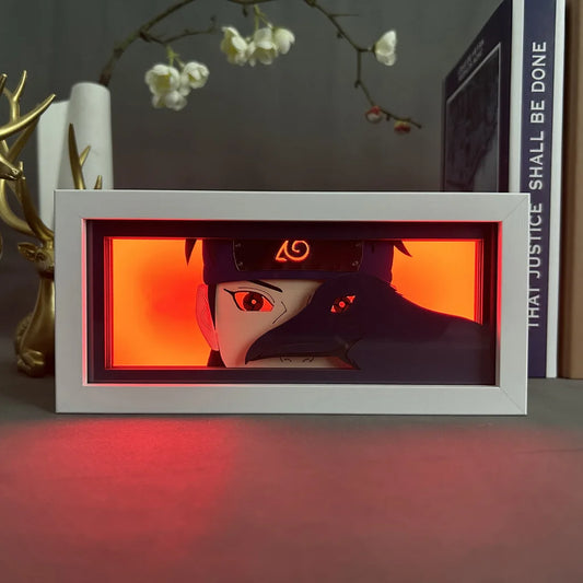 <img src="shisui.jpg" alt="LED lightbox featuring Shisui Uchiha from Naruto Shippuden anime, vibrant nightlight decor for anime lovers. Shisui Uchiha with Sharingan eyes, set against a glowing red background, capturing the intense and mysterious aura of this legendary Uchiha clan member. Perfect for Naruto fans, anime-themed room decor, and unique anime merchandise. High-quality LED frame showcasing Shisui’s iconic look, ideal for collectors of Naruto Shippuden items and Japanese anime enthusiasts seeking">