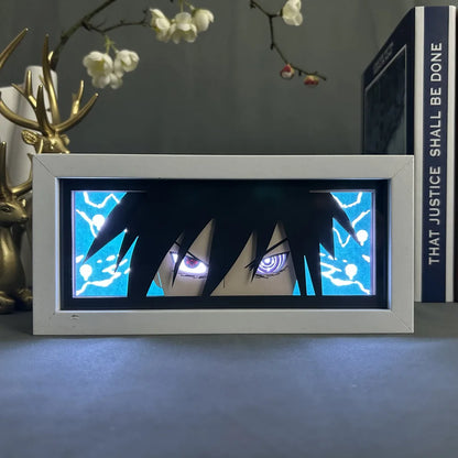 <img src="sasuke-rinnegan.jpg" alt="LED lightbox featuring Sasuke Uchiha with Rinnegan eyes from Naruto Shippuden anime, powerful wall decor for anime and manga fans. Sasuke in his iconic Rinnegan mode, showcasing intense gaze and electric blue lightning background. Perfect for Naruto fans, anime room decor, Naruto Shippuden collectibles, and unique anime gifts. High-quality LED frame with Sasuke Uchiha, highlighting his legendary Sharingan and Rinnegan abilities. Ideal for Naruto merchandise collectors.">